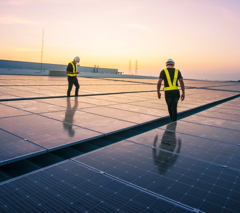 two men construction solar project