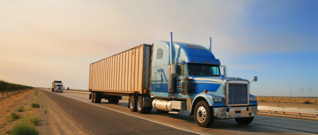 Truck on a highway transporting solar equipment