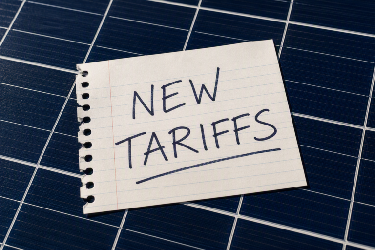Solar panel grid with a note reading "New Tariffs"